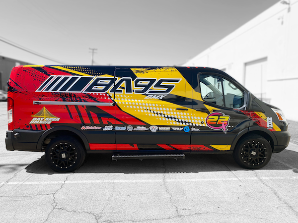 Custom vehicle wrap design on commercial van with bold graphics