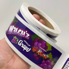 Custom roll labels for grape product packaging with a colorful purple fruit design and glossy finish.