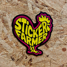 Spot UV Sticker with 'Sticker Farmer' text on a textured surface